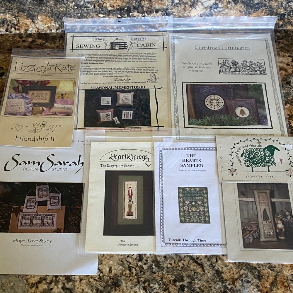 Bundle of 7 vintage cross stitch patterns  and samplers.